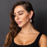 Blue Cap Pearl Earrings worn by model