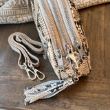 Snake print bag top view with 3 zippers