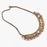 Necklace with AB Rhinestones and pearls on a white background