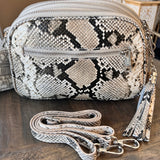 Snake Print Camera Bag on  wood table