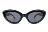 Black cat-eye sunglasses with dark lenses on a white background
