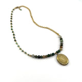 Green & Gold Necklace with a Vintage Locket on a white background